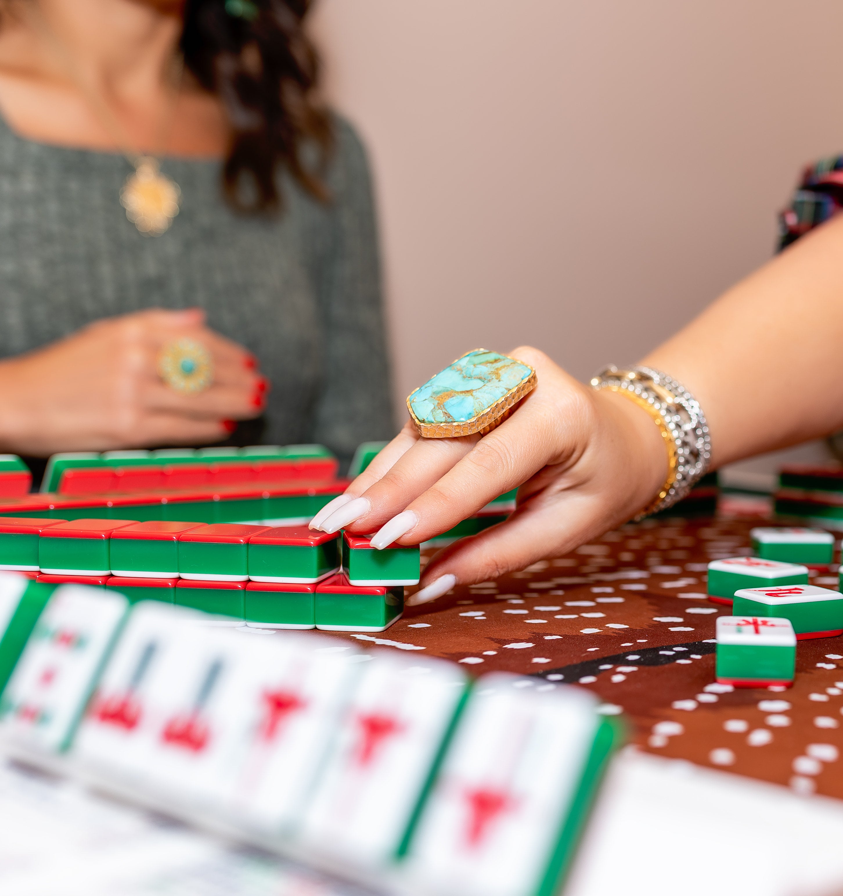 The turquoise stone is cut into a shield shape and placed in an 18K gold-plated sterling silver ring