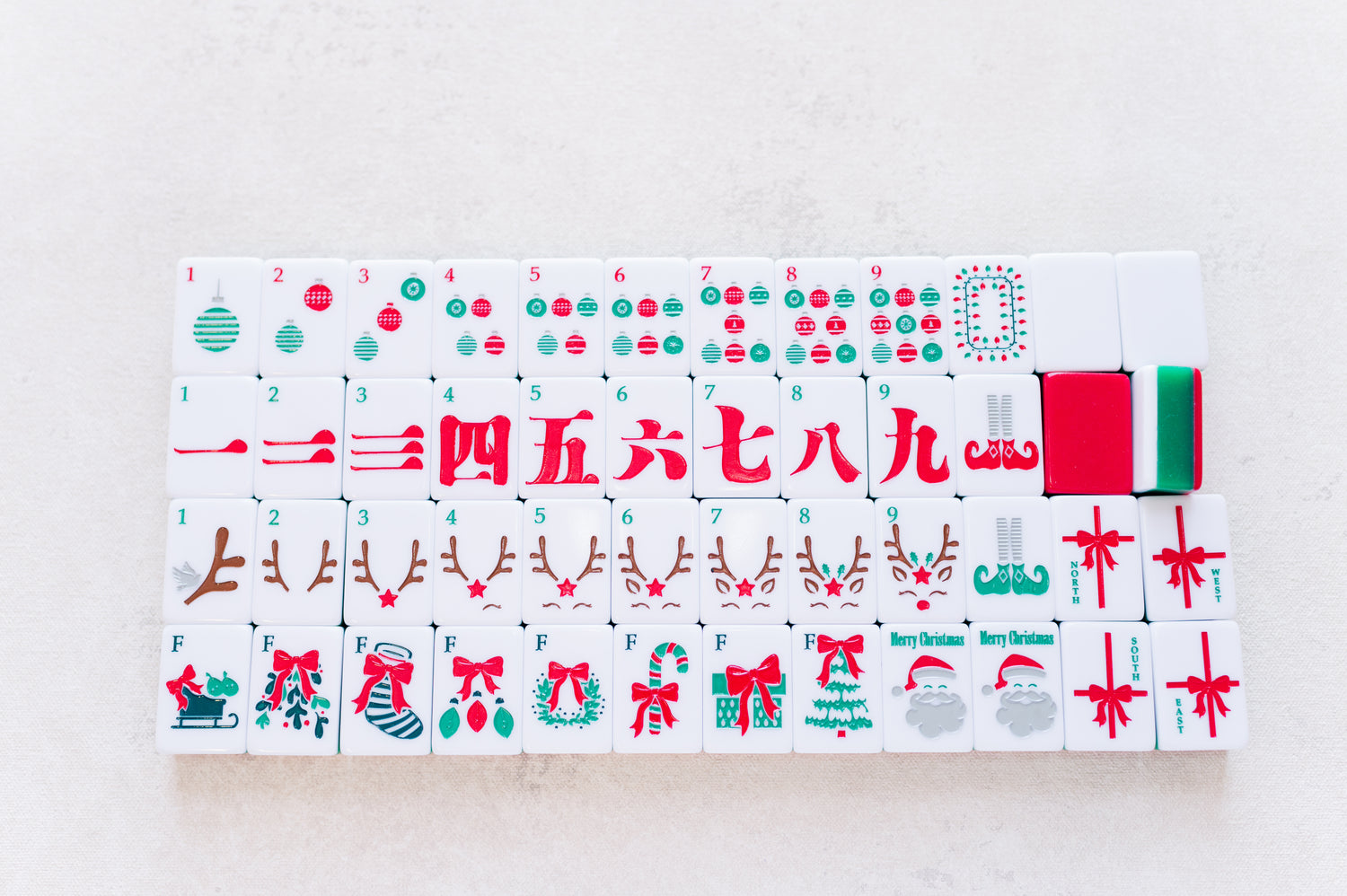 Set of Christmas-themed tiles with various designs on a light gray background