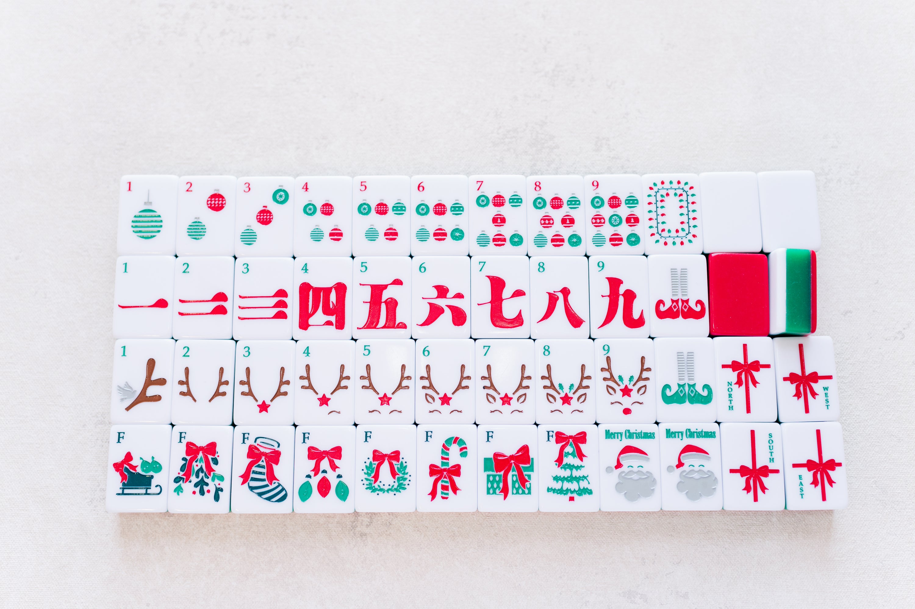 Set of Christmas-themed tiles with various designs on a light gray background