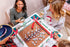friends playing a unique Christmas mahjong set from Hip Hip Mahjong